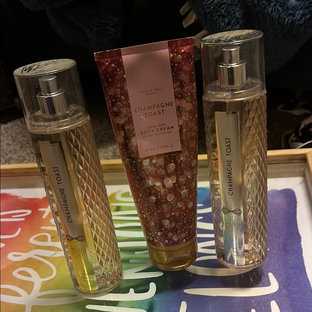 2 bath and body Champagne Toast body spray and 1 lotion